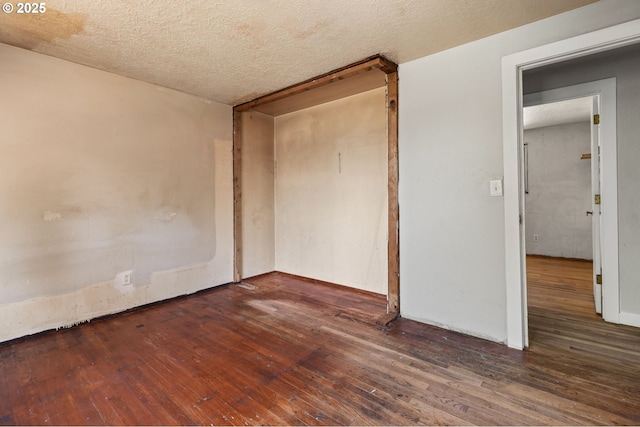 1203 NE 190th Pl, Portland, OR 97230 - unfurnished bedroom featuring hardwood / wood-style flooring and a textured ceiling