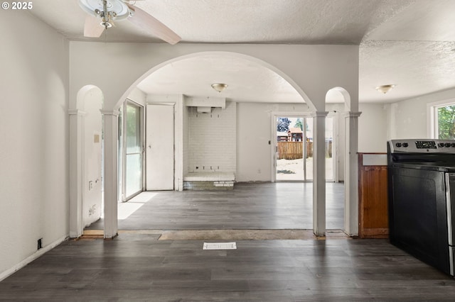 1203 NE 190th Pl, Portland, OR 97230 - kitchen with electric stove, a textured ceiling, wood finished floors, decorative columns, and arched walkways
