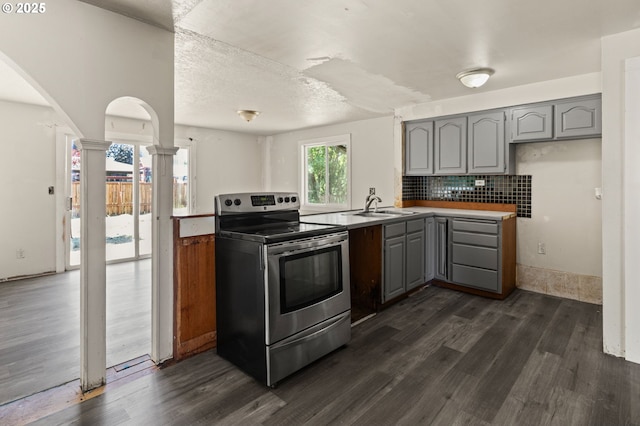 1203 NE 190th Pl, Portland, OR 97230 - kitchen featuring stainless steel range with electric cooktop, gray cabinetry, a sink, decorative columns, and dark wood-style flooring