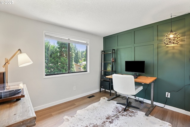 16905 Webster Rd, Gladstone, OR 97027 - office area featuring baseboards, wood finished floors, and a textured ceiling