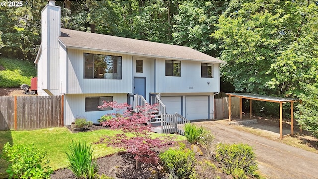 16905 Webster Rd, Gladstone, OR 97027 - split foyer home featuring driveway, an attached garage, a chimney, and a shingled roof