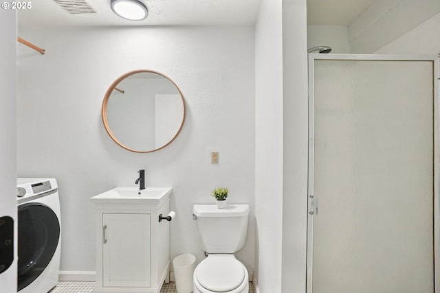 16905 Webster Rd, Gladstone, OR 97027 - full bath with washer / clothes dryer, a shower stall, toilet, and vanity