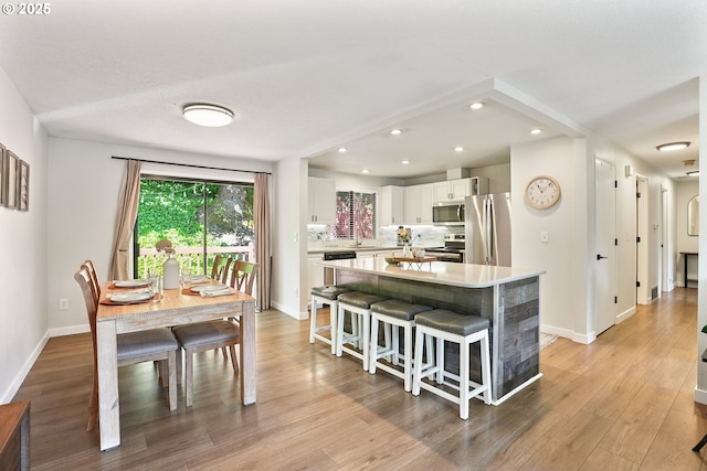 16905 Webster Rd, Gladstone, OR 97027 - dining area with baseboards, recessed lighting, and light wood-type flooring
