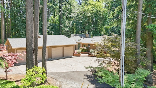 12028 SW Lesser Rd, Portland, OR 97219 - view of front of property with a garage, driveway, and roof with shingles