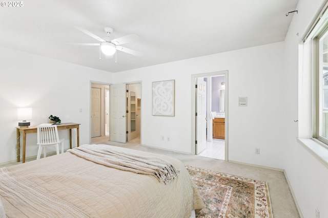12028 SW Lesser Rd, Portland, OR 97219 - bedroom featuring light carpet, baseboards, a spacious closet, and ensuite bathroom