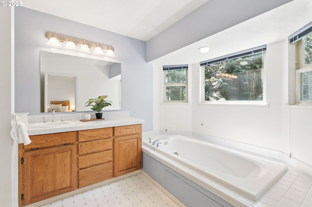 12028 SW Lesser Rd, Portland, OR 97219 - bathroom featuring vanity, a jetted tub, and tile patterned floors