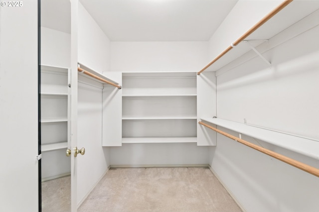 12028 SW Lesser Rd, Portland, OR 97219 - walk in closet featuring light colored carpet