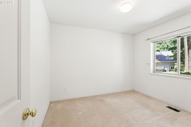 12028 SW Lesser Rd, Portland, OR 97219 - carpeted empty room featuring baseboards
