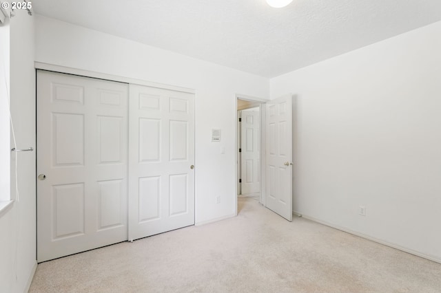 12028 SW Lesser Rd, Portland, OR 97219 - unfurnished bedroom with carpet floors and a closet