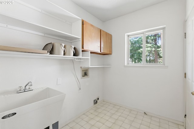 12028 SW Lesser Rd, Portland, OR 97219 - washroom with cabinet space, hookup for a washing machine, light floors, baseboards, and hookup for an electric dryer