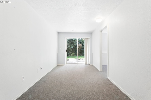 12028 SW Lesser Rd, Portland, OR 97219 - spare room featuring carpet flooring and baseboards