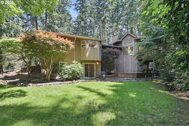 12028 SW Lesser Rd, Portland, OR 97219 - rear view of property featuring a lawn and a chimney