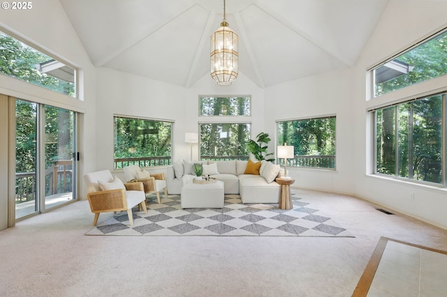 12028 SW Lesser Rd, Portland, OR 97219 - sunroom / solarium featuring high vaulted ceiling, carpet floors, and a chandelier