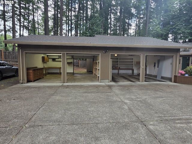 12028 SW Lesser Rd, Portland, OR 97219 - garage featuring concrete driveway