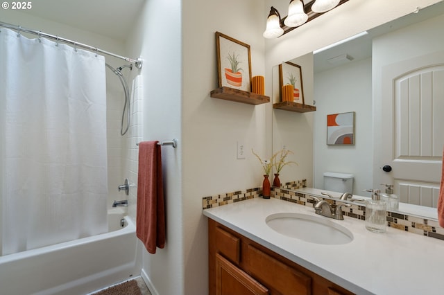full bathroom featuring shower / tub combo, vanity, and toilet