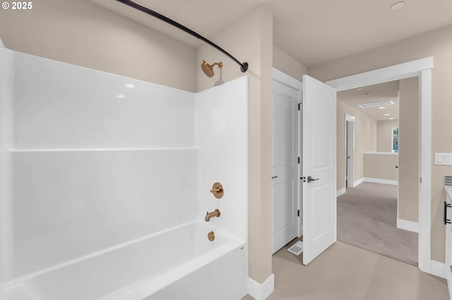 bathroom with shower / washtub combination, baseboards, and visible vents