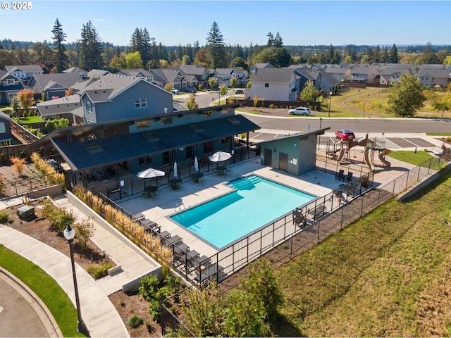 pool featuring fence, a residential view, and a patio
