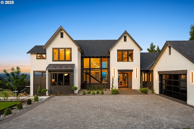 modern farmhouse featuring a garage