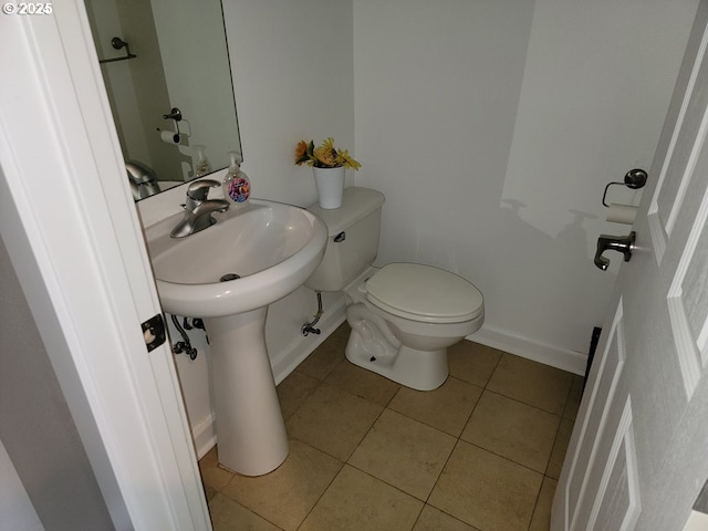 bathroom featuring tile patterned floors and toilet