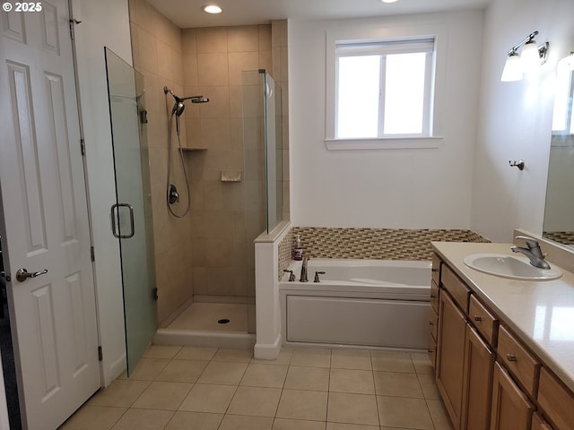 bathroom with vanity, independent shower and bath, and tile patterned flooring