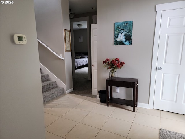 corridor featuring light tile patterned flooring