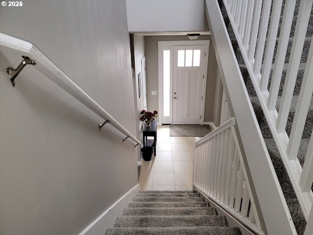 staircase featuring tile patterned flooring