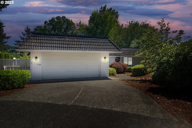 17141 Hofer Ct, Lake Oswego, OR 97034 - view of front facade with a tiled roof, concrete driveway, and a garage