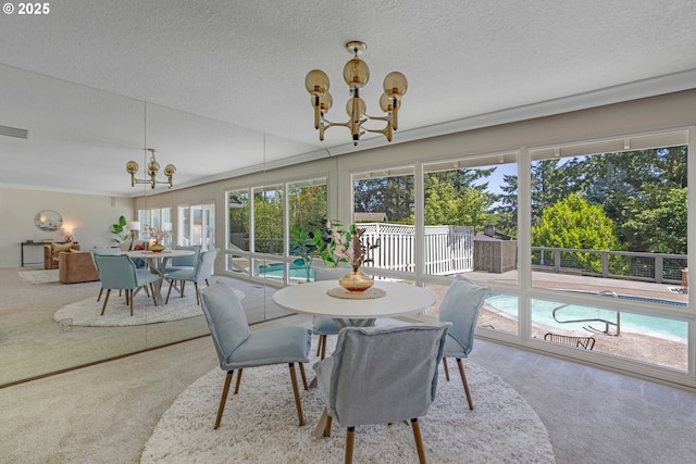 17141 Hofer Ct, Lake Oswego, OR 97034 - carpeted dining area featuring a chandelier, plenty of natural light, and a textured ceiling