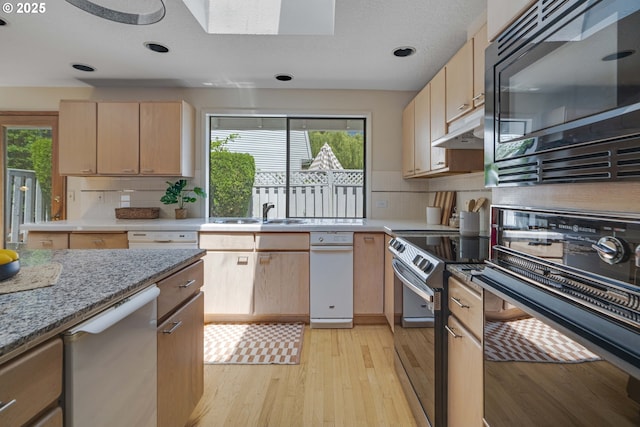 17141 Hofer Ct, Lake Oswego, OR 97034 - kitchen with appliances with stainless steel finishes, light brown cabinetry, light wood finished floors, healthy amount of natural light, and recessed lighting