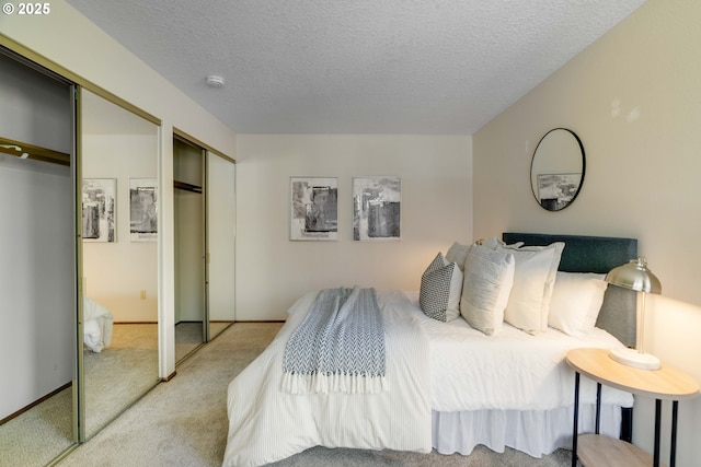 17141 Hofer Ct, Lake Oswego, OR 97034 - carpeted bedroom with two closets and a textured ceiling
