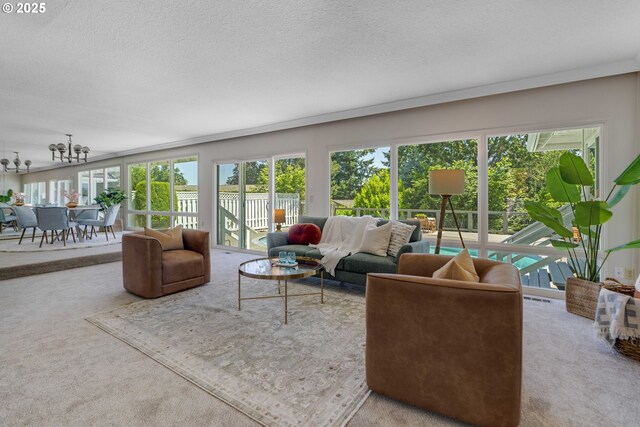 17141 Hofer Ct, Lake Oswego, OR 97034 - carpeted living room with a textured ceiling and a chandelier