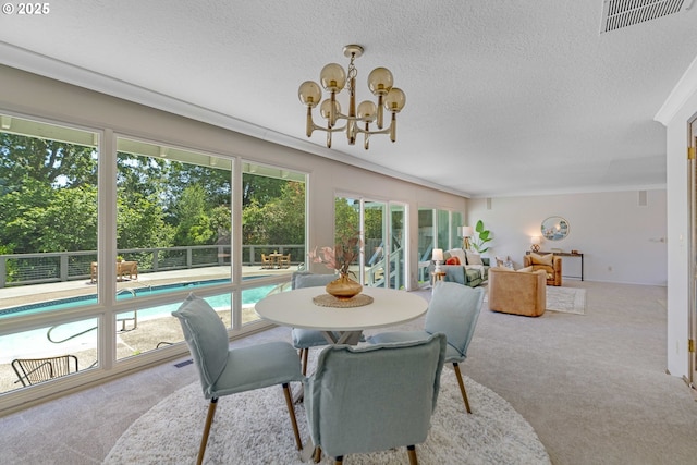 17141 Hofer Ct, Lake Oswego, OR 97034 - dining room with carpet floors, a textured ceiling, and a chandelier