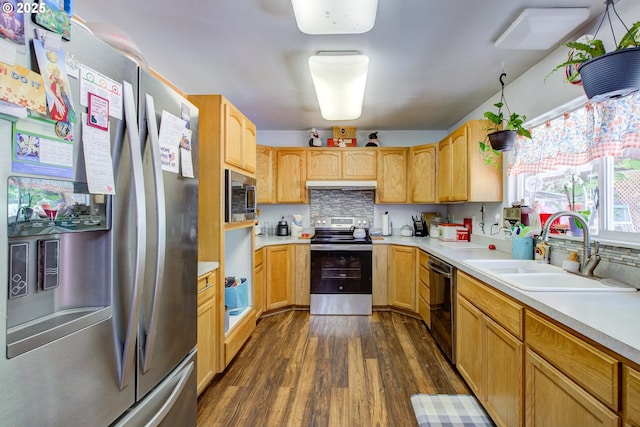 590 Fairchild St, Canyonville, OR 97417 - kitchen with stainless steel appliances, under cabinet range hood, light countertops, a sink, and dark wood-style floors