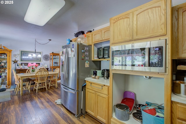 590 Fairchild St, Canyonville, OR 97417 - kitchen with light brown cabinets, stainless steel appliances, light countertops, dark wood finished floors, and a notable chandelier