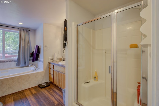 590 Fairchild St, Canyonville, OR 97417 - bathroom featuring wood finished floors, a shower stall, a bath, and vanity