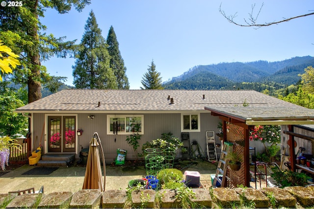 590 Fairchild St, Canyonville, OR 97417 - back of house featuring french doors, a patio, a shingled roof, and a mountain view