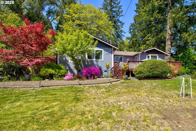 590 Fairchild St, Canyonville, OR 97417 - view of front facade featuring a front lawn, a wooden deck, and crawl space
