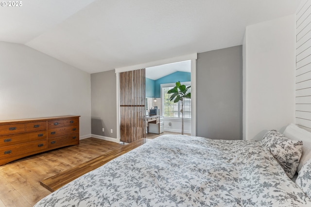 17948 SW Robert Ln, Beaverton, OR 97078 - bedroom featuring vaulted ceiling, wood finished floors, and baseboards