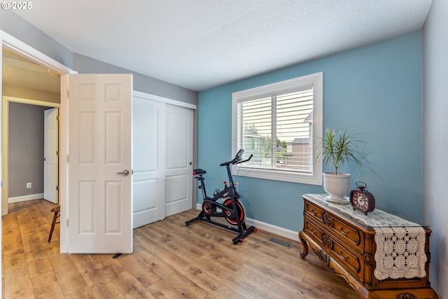 17948 SW Robert Ln, Beaverton, OR 97078 - exercise room featuring light wood finished floors and baseboards