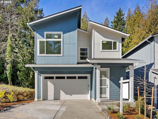 contemporary home featuring driveway and an attached garage