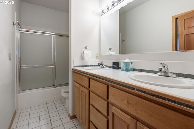 18144 Maury Mountain Ln, Sunriver, OR 97707 - bathroom featuring double vanity, toilet, tile patterned floors, and a sink