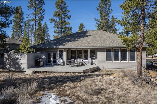 18144 Maury Mountain Ln, Sunriver, OR 97707 - rear view of house with french doors, roof with shingles, and a wooden deck