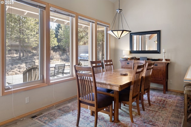 18144 Maury Mountain Ln, Sunriver, OR 97707 - dining room featuring baseboards, visible vents, wood finished floors, and a wealth of natural light