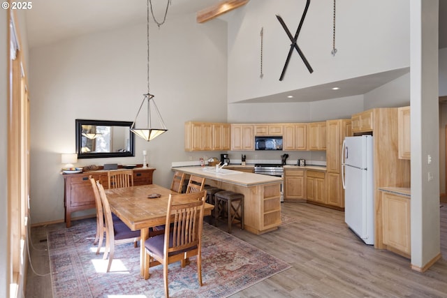18144 Maury Mountain Ln, Sunriver, OR 97707 - dining room featuring light wood-style floors and high vaulted ceiling