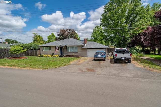 4033 Hanna St, Roseburg, OR 97471 - ranch-style house featuring asphalt driveway, a chimney, and a garage