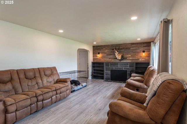 4033 Hanna St, Roseburg, OR 97471 - living room with arched walkways, recessed lighting, wood finished floors, and a tile fireplace