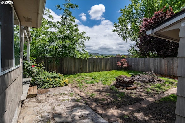 4033 Hanna St, Roseburg, OR 97471 - fenced backyard featuring a fire pit and a patio