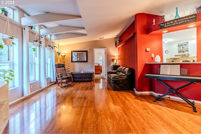 living area featuring wood finished floors and baseboards