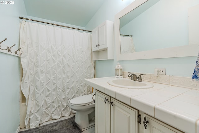 full bath with toilet, shower / bath combo, and vanity