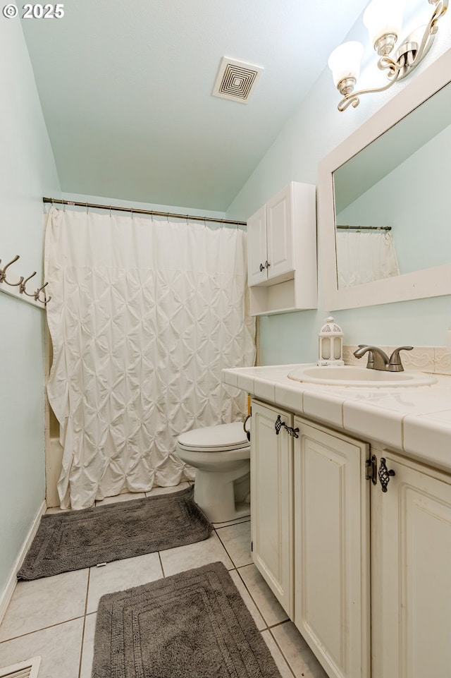 bathroom with visible vents, shower / bathtub combination with curtain, toilet, vanity, and tile patterned floors